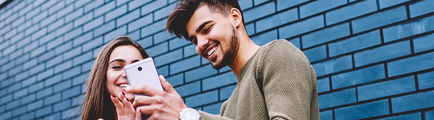 friends looking at phone